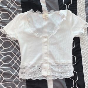 Crop top with lace at the ends.